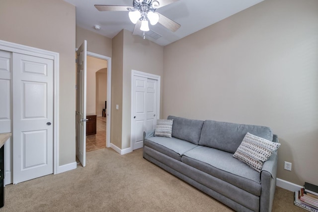 3126 San Gabriel Ave, Clovis, CA 93619 - living room with light carpet, baseboards, and a ceiling fan