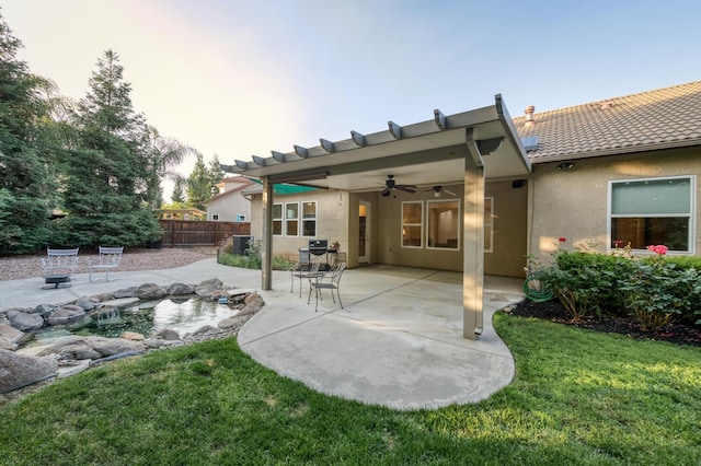 3126 San Gabriel Ave, Clovis, CA 93619 - back of property with ceiling fan, stucco siding, a patio area, and a tiled roof