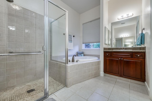 3126 San Gabriel Ave, Clovis, CA 93619 - bathroom with vanity, a garden tub, tile patterned floors, and a stall shower