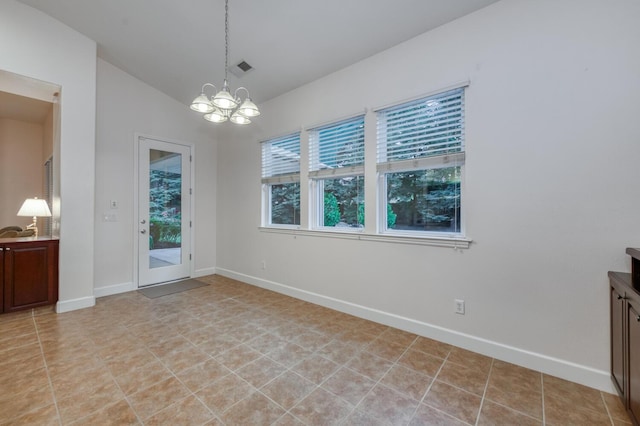 3126 San Gabriel Ave, Clovis, CA 93619 - unfurnished dining area with a chandelier, baseboards, and lofted ceiling