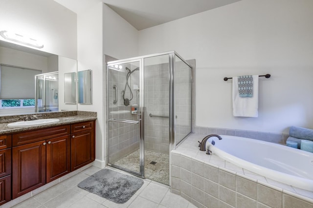 3126 San Gabriel Ave, Clovis, CA 93619 - bathroom featuring vanity, a garden tub, a shower stall, and tile patterned floors