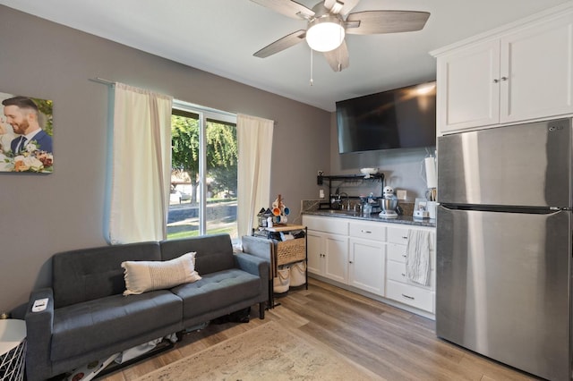 2724 Monocott Dr, Madera, CA 93637 - living room featuring light wood-style floors and a ceiling fan