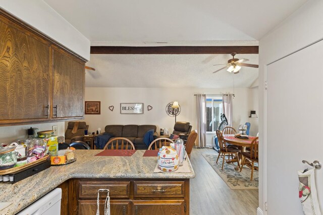 2724 Monocott Dr, Madera, CA 93637 - kitchen with open floor plan, wood finished floors, a ceiling fan, a peninsula, and light stone counters