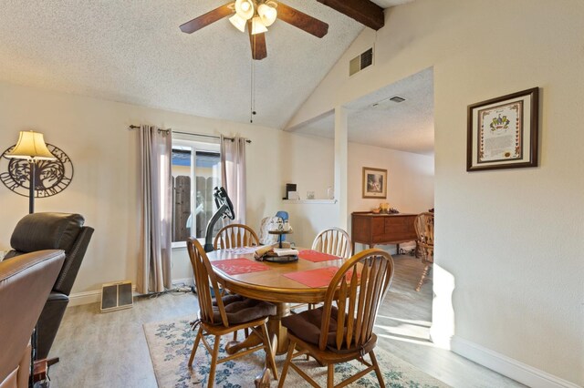 2724 Monocott Dr, Madera, CA 93637 - dining space featuring light wood-style flooring, beam ceiling, a ceiling fan, baseboards, and a textured ceiling