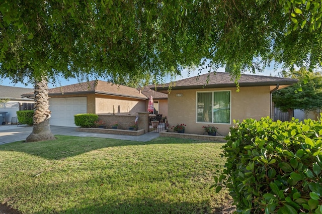 2724 Monocott Dr, Madera, CA 93637 - view of front of home featuring stucco siding, an attached garage, and driveway