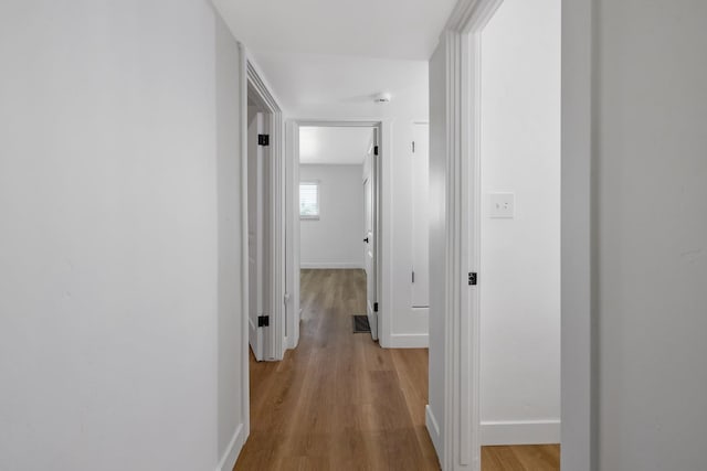 5075 N College Ave, Fresno, CA 93704 - hall featuring light wood-style floors and baseboards
