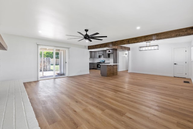 5075 N College Ave, Fresno, CA 93704 - unfurnished living room with light wood finished floors, baseboards, ceiling fan, and recessed lighting