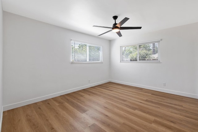 5075 N College Ave, Fresno, CA 93704 - spare room with plenty of natural light, wood finished floors, baseboards, and ceiling fan