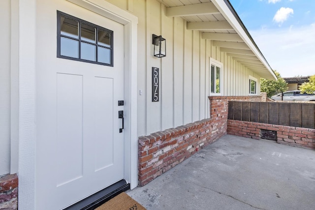 5075 N College Ave, Fresno, CA 93704 - property entrance featuring board and batten siding and brick siding