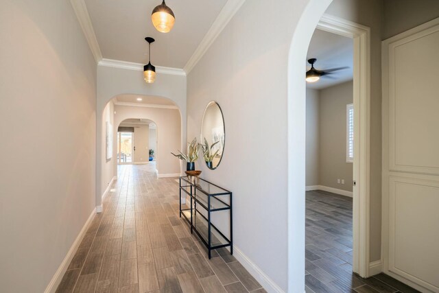 3343 Richmond Ave, Clovis, CA 93619 - corridor with arched walkways, wood finished floors, baseboards, and crown molding