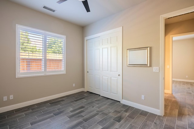 3343 Richmond Ave, Clovis, CA 93619 - unfurnished bedroom with dark wood-style floors, baseboards, and a closet