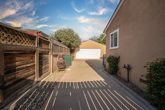2837 N Thorne Ave, Fresno, CA 93704 - view of patio featuring an outbuilding and a detached garage