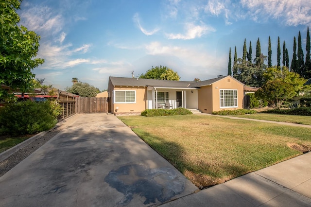 2837 N Thorne Ave, Fresno, CA 93704 - view of front of property with stucco siding, concrete driveway, and a porch
