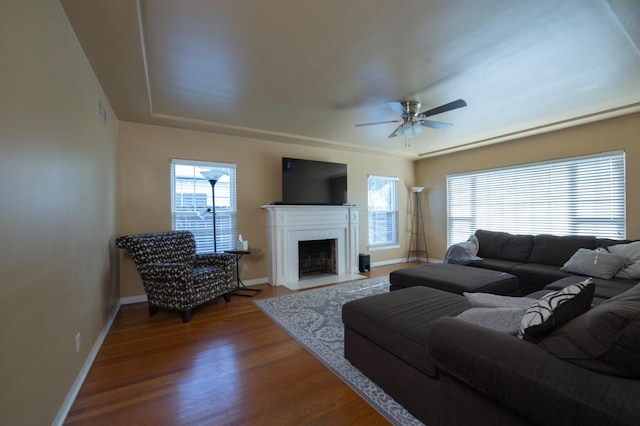 2837 N Thorne Ave, Fresno, CA 93704 - living area featuring healthy amount of natural light, wood finished floors, a fireplace with flush hearth, and ceiling fan