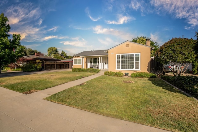 2837 N Thorne Ave, Fresno, CA 93704 - ranch-style home with a front yard, a chimney, and stucco siding