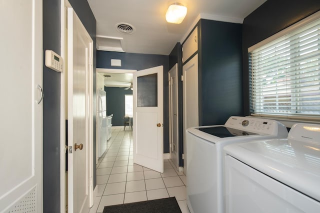 2837 N Thorne Ave, Fresno, CA 93704 - washroom featuring light tile patterned floors, washing machine and dryer, and baseboards