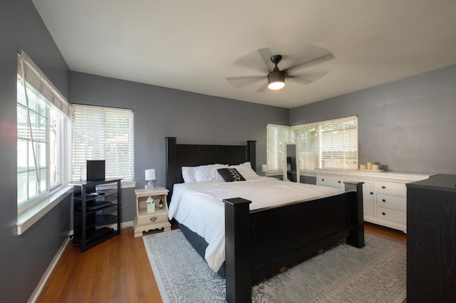 2837 N Thorne Ave, Fresno, CA 93704 - bedroom featuring dark wood finished floors, multiple windows, and baseboards