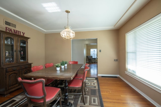 2837 N Thorne Ave, Fresno, CA 93704 - dining area with a chandelier, light wood finished floors, and baseboards