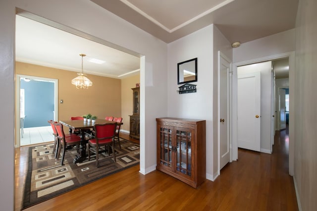 2837 N Thorne Ave, Fresno, CA 93704 - dining room featuring wood finished floors, a chandelier, and baseboards