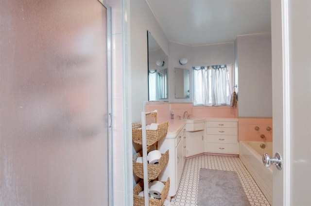 2837 N Thorne Ave, Fresno, CA 93704 - bathroom featuring a shower stall, vanity, a bath, and tile patterned flooring