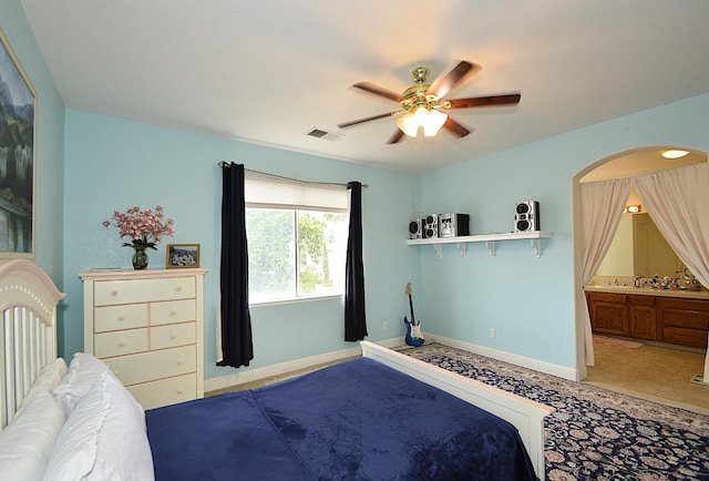 1756 N Holly Ave, Clovis, CA 93619 - bedroom with baseboards, a ceiling fan, and connected bathroom