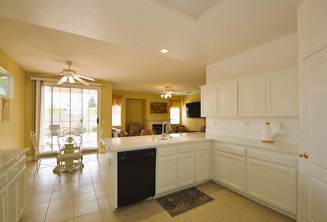 1756 N Holly Ave, Clovis, CA 93619 - kitchen with black dishwasher, a sink, a ceiling fan, a peninsula, and healthy amount of natural light