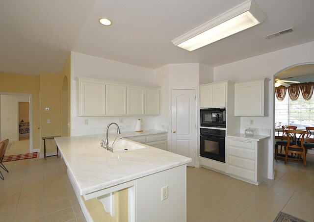 1756 N Holly Ave, Clovis, CA 93619 - kitchen featuring black appliances, a sink, arched walkways, white cabinetry, and ceiling fan