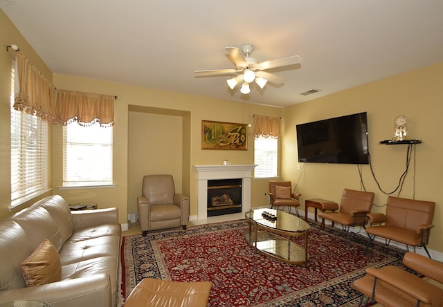 1756 N Holly Ave, Clovis, CA 93619 - living room with a ceiling fan, a fireplace with flush hearth, and baseboards