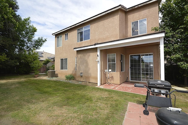1756 N Holly Ave, Clovis, CA 93619 - rear view of house featuring stucco siding, central AC unit, and a patio area