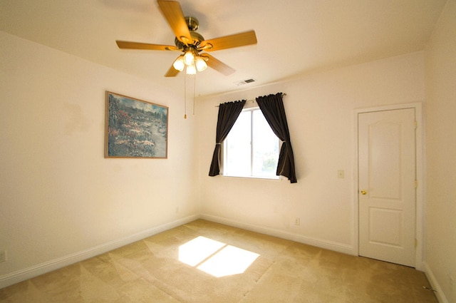 1756 N Holly Ave, Clovis, CA 93619 - spare room with light carpet, a ceiling fan, and baseboards