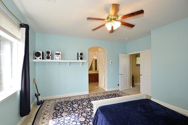 1756 N Holly Ave, Clovis, CA 93619 - bedroom with arched walkways, baseboards, and ceiling fan