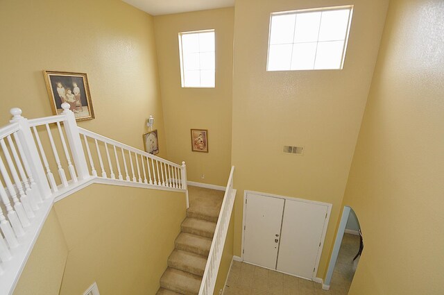 1756 N Holly Ave, Clovis, CA 93619 - stairway featuring baseboards and a towering ceiling