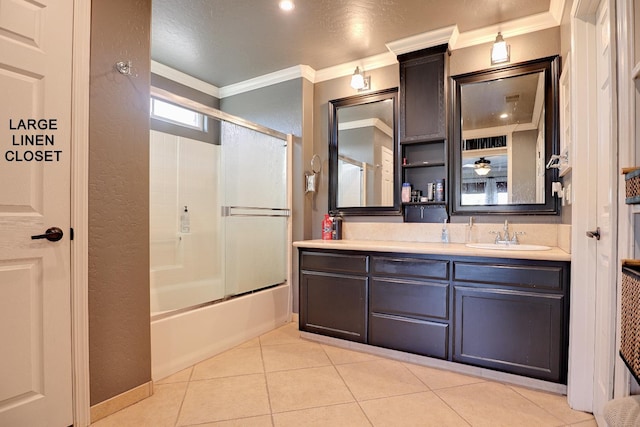 3356 N Burgan Ave, Fresno, CA 93727 - bathroom featuring crown molding, tile patterned floors, vanity, shower / bath combination with glass door, and a textured wall