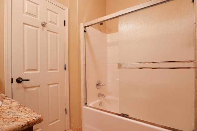 3356 N Burgan Ave, Fresno, CA 93727 - bathroom featuring bath / shower combo with glass door