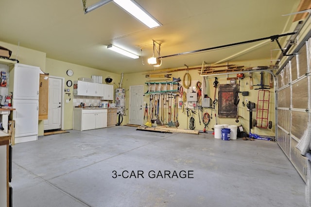 3356 N Burgan Ave, Fresno, CA 93727 - garage with a garage door opener and water heater