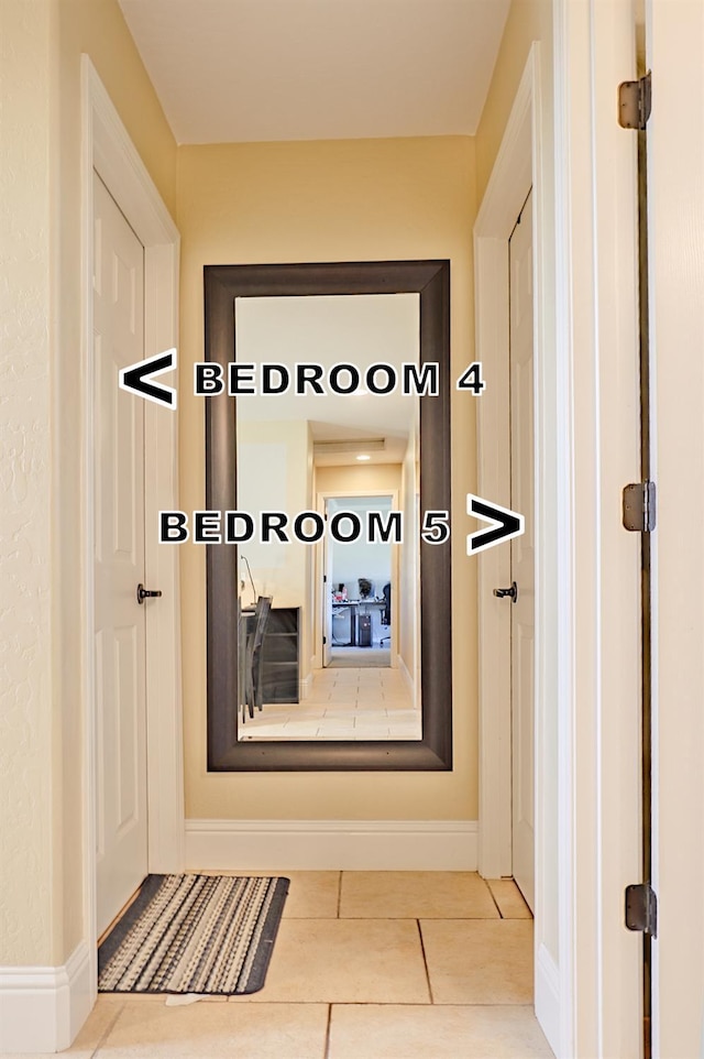 3356 N Burgan Ave, Fresno, CA 93727 - hallway with tile patterned floors and baseboards
