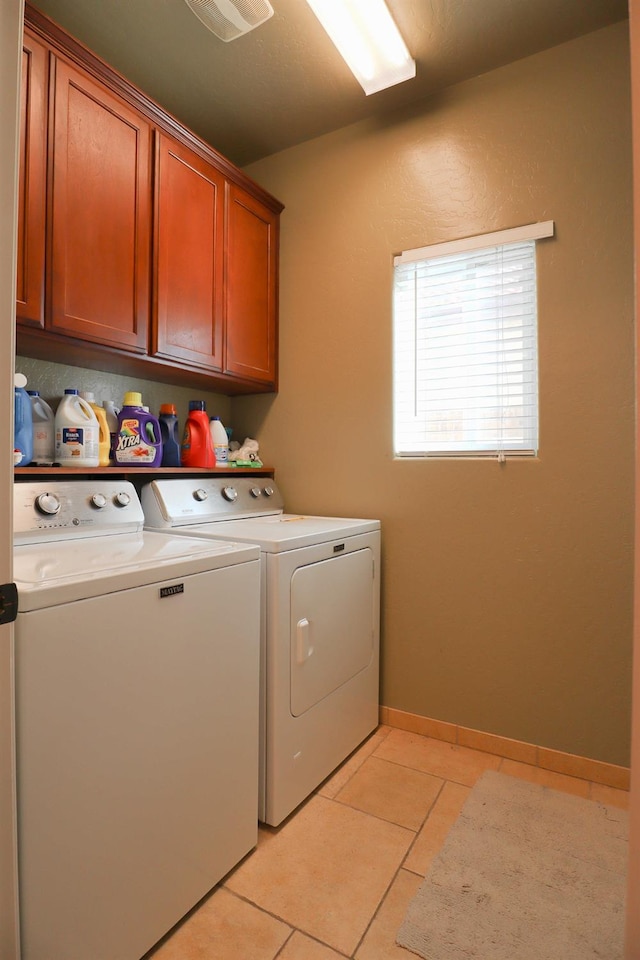 3356 N Burgan Ave, Fresno, CA 93727 - washroom with washing machine and clothes dryer, cabinet space, and light tile patterned floors