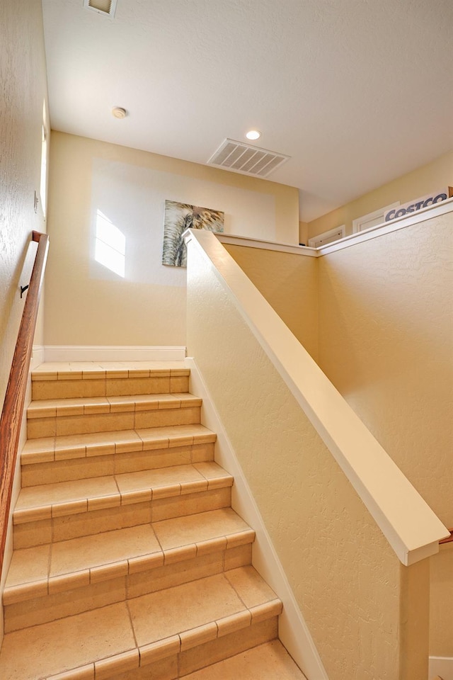 3356 N Burgan Ave, Fresno, CA 93727 - stairs featuring a textured wall and recessed lighting