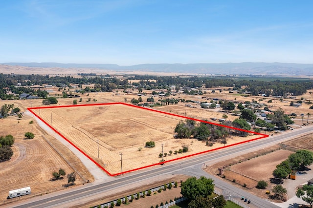 8574 E Herndon Ave, Clovis, CA 93619 - overview of rural landscape with property boundaries highlighted and a mountainous background