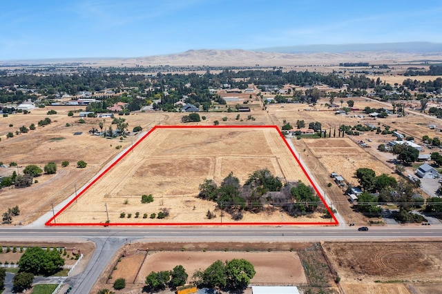 8574 E Herndon Ave, Clovis, CA 93619 - view of property location with property boundaries highlighted and a mountain backdrop