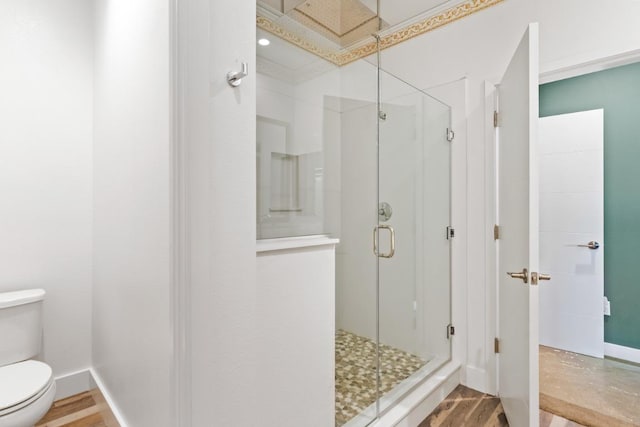 977 24th St, Oakland, CA 94607 - full bath featuring toilet, a stall shower, wood finished floors, and baseboards