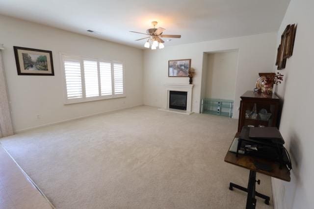 1976 Decatur Ave, Clovis, CA 93611 - living area featuring light carpet, ceiling fan, and a glass covered fireplace