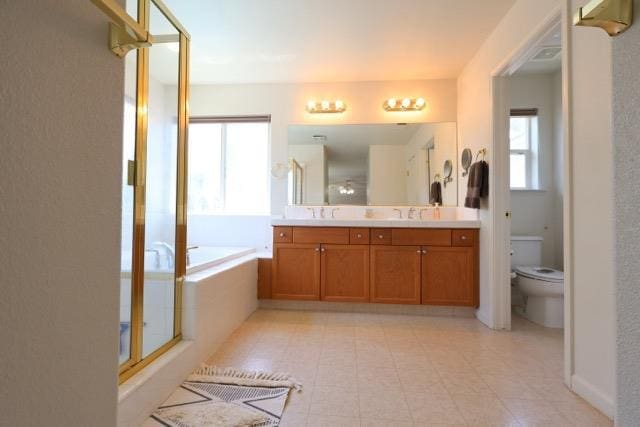 1976 Decatur Ave, Clovis, CA 93611 - full bath featuring double vanity, a garden tub, toilet, and a shower stall