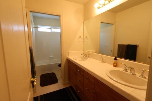 1976 Decatur Ave, Clovis, CA 93611 - bathroom with double vanity, shower / bath combination, and tile patterned floors