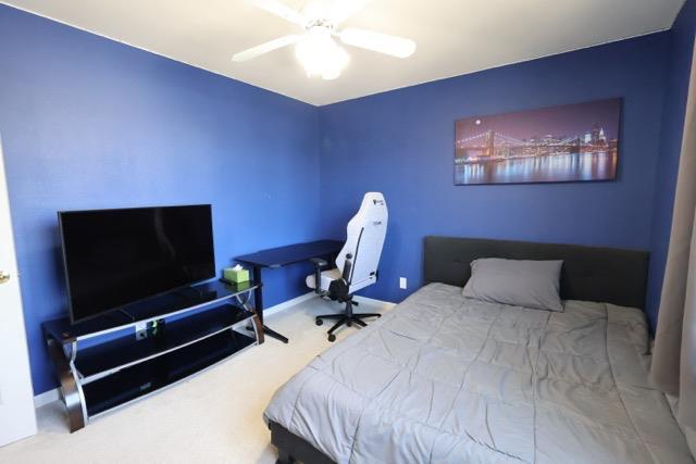 1976 Decatur Ave, Clovis, CA 93611 - carpeted bedroom featuring baseboards and a ceiling fan