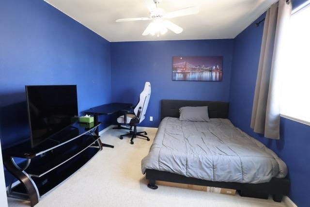 1976 Decatur Ave, Clovis, CA 93611 - bedroom featuring carpet floors, ceiling fan, and baseboards