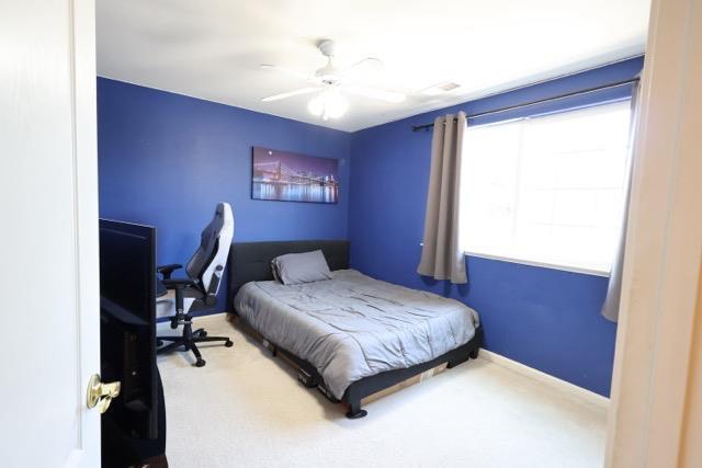 1976 Decatur Ave, Clovis, CA 93611 - carpeted bedroom with a ceiling fan