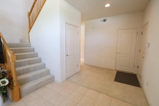 1976 Decatur Ave, Clovis, CA 93611 - foyer with light colored carpet, stairway, and recessed lighting