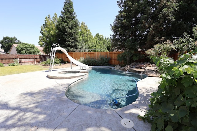 1976 Decatur Ave, Clovis, CA 93611 - view of pool with a water slide, a fenced backyard, a pool with connected hot tub, and a patio area