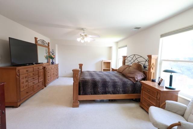 1976 Decatur Ave, Clovis, CA 93611 - bedroom with light colored carpet and ceiling fan